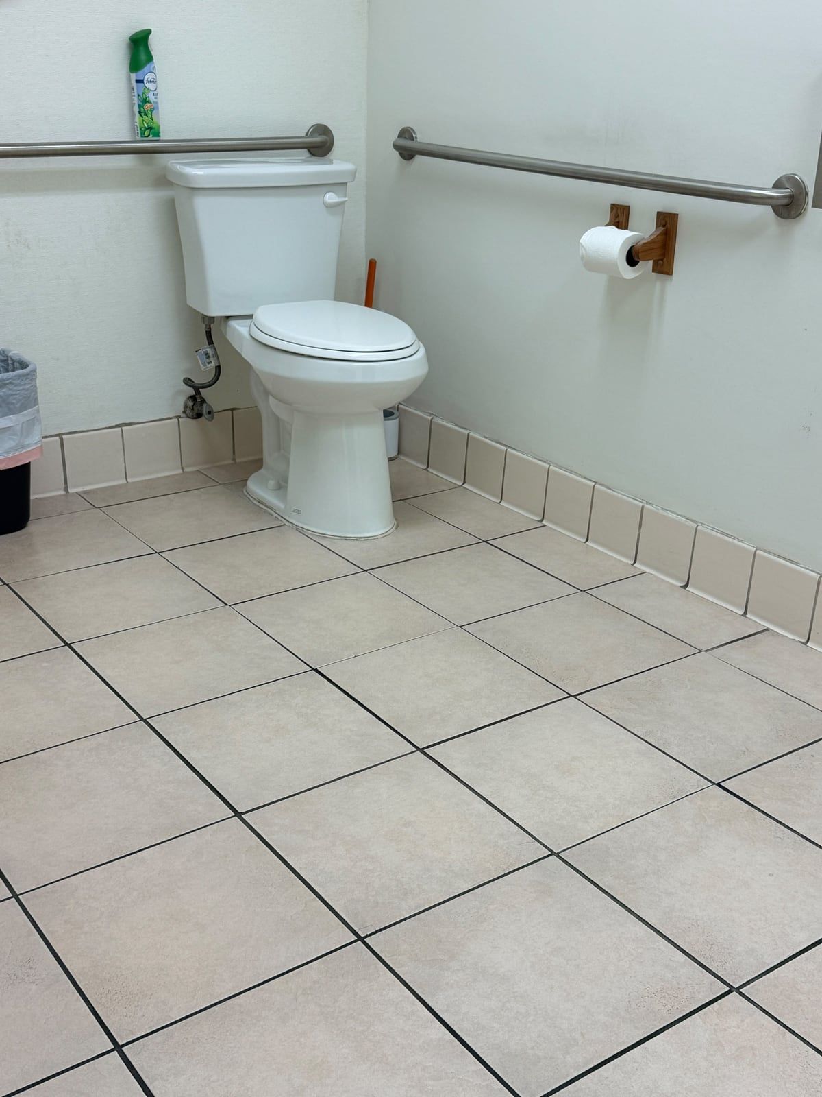 The same restroom tile floor, evenly clean and bright